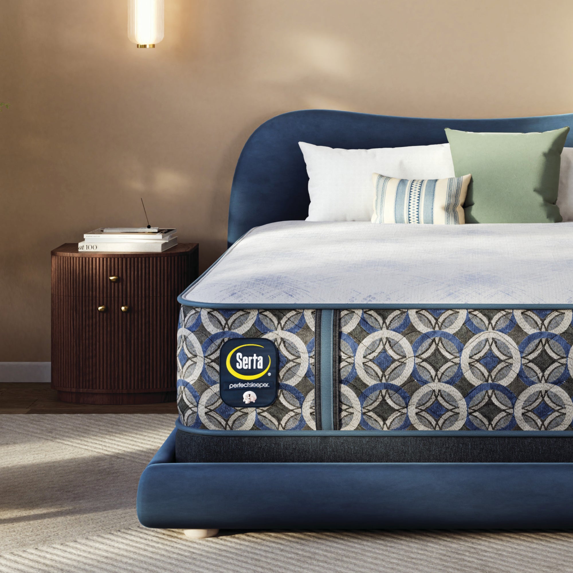 Serta perfect sleeper hybrid medium mattress with decorative headboard and pillows in a bedroom setting