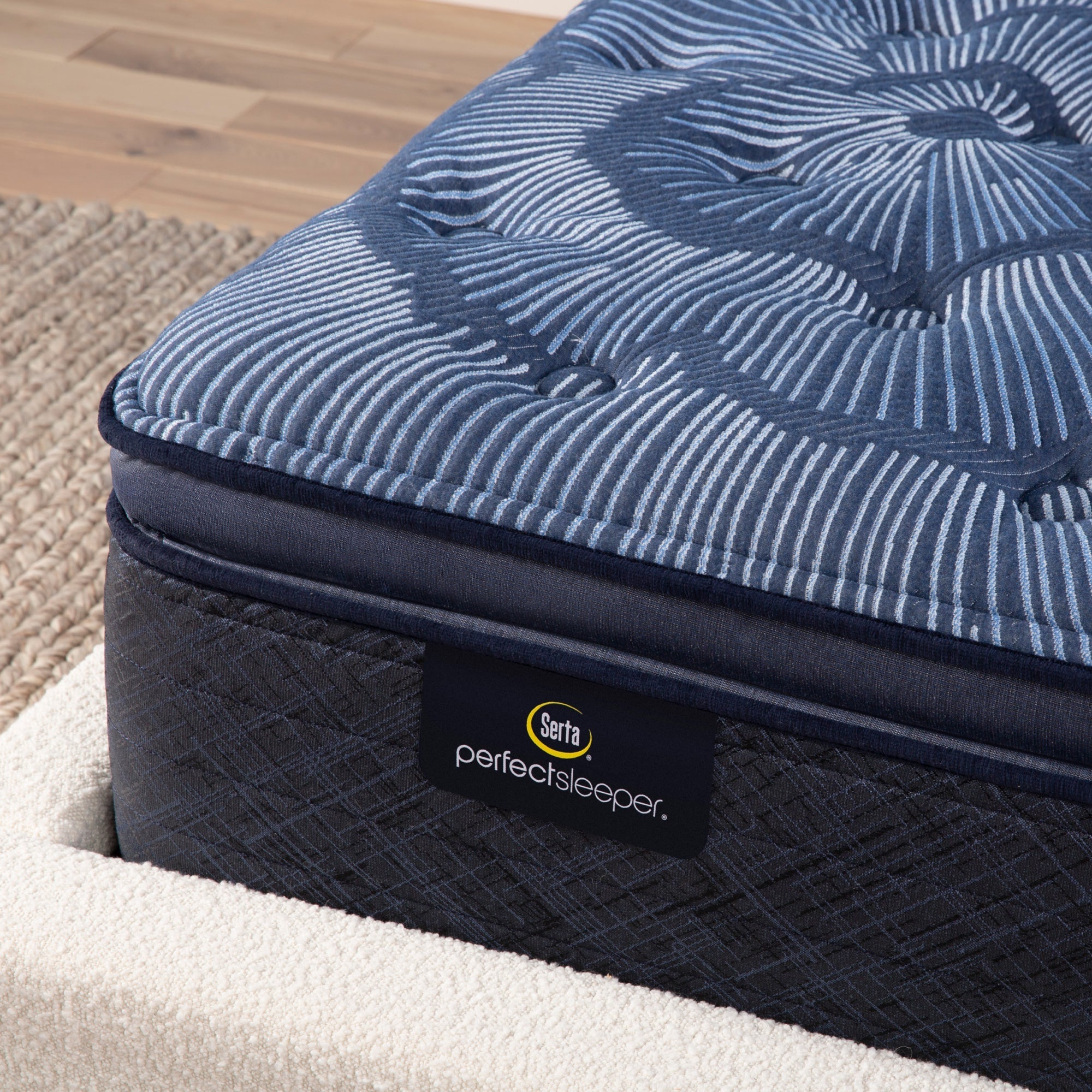 Corner detail of a Serta Perfect Sleeper firm pillow top mattress||feel: firm pillow top||level: ultimate