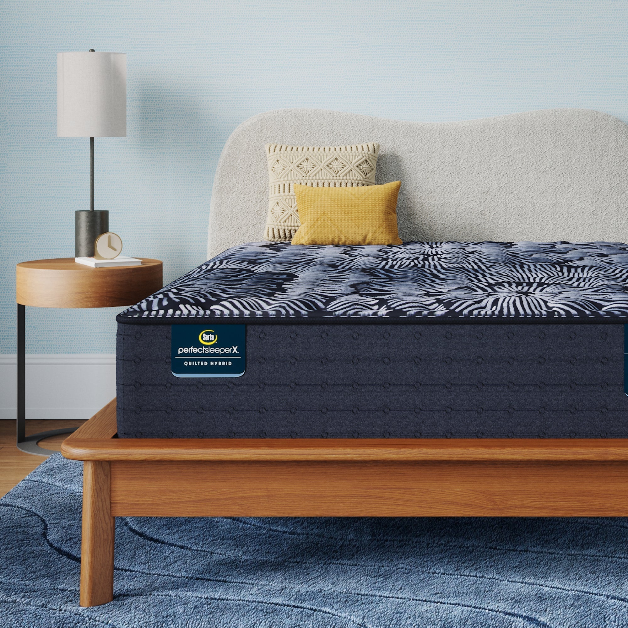 Perfect Sleeper X Quilted Hybrid Knox Firm Mattress sitting in a brown bedframe || feel: Firm || level: Level 1