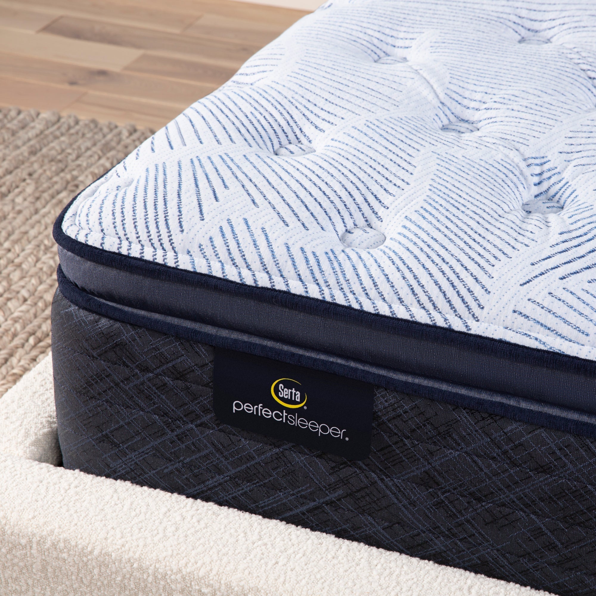 Corner detail of a Serta Perfect Sleeper plush pillow top mattress||feel: plush pillow top||level: enhanced